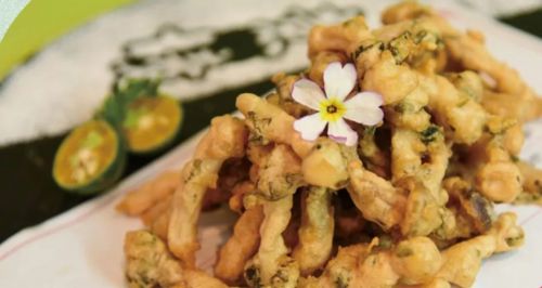 李沧区一家酒店餐厅推出的鲜香椿脆炸小蘑菇